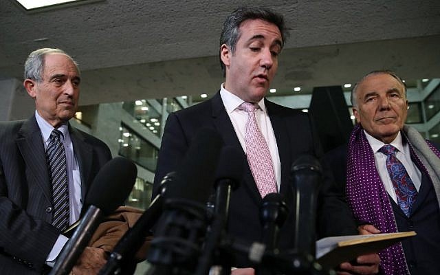 Michael Cohen, center , former attorney and fixer for US President Donald Trump, reads a statement to the media at the Hart Senate Office Building after testifying to the Senate Intelligence Committee on Capitol Hill in Washington, DC, February 26, 2019. (Mark Wilson/Getty Images/AFP) Michael Cohen, center , former attorney and fixer for US President Donald Trump, reads a statement to the media at the Hart Senate Office Building after testifying to the Senate Intelligence Committee on Capitol Hill in Washington, DC, February 26, 2019. (Mark Wilson/Getty Images/AFP)
