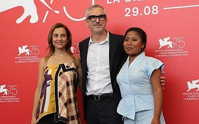 'Roma' director Alfonso Cuaron, center, with two of the film’s stars, Marina de Tavira, left, and lead Yalitza Aparicio at the 75th Venice Film Festival, August 30, 2018. (Vittorio Zunino Celotto/Getty Images)