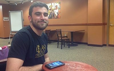 Josh Boloña, pictured sitting in his campus library, is the president of the Student Government Association at the University of Central Florida. (Ben Sales)