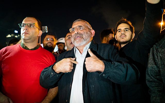 Michael Ben Ari, head of far-right Otzma Yehudit, and supporters at a Tel Aviv demonstration, November 15, 2018. (Luke Tress/Times of Israel) Michael Ben Ari, head of far-right Otzma Yehudit, and supporters at a Tel Aviv demonstration, November 15, 2018. (Luke Tress/Times of Israel)