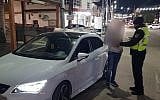 Police question a 15-year-old boy who helped his brother, 5, drive their parents' car. (Israel Police)