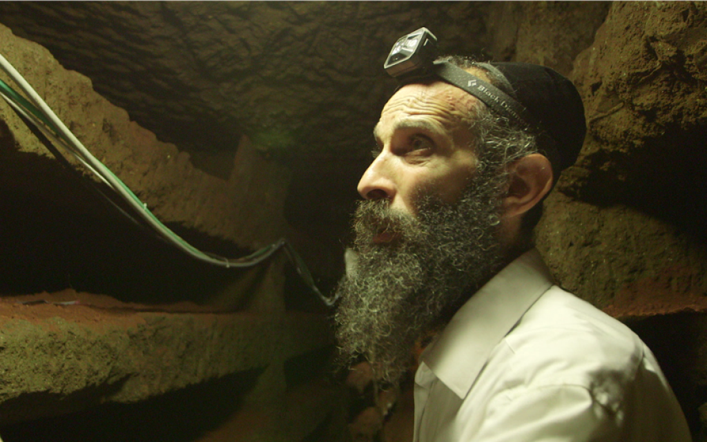 Rabbi Chizkiya Kalmanovich from the European Committee for the .Protection of Jewish Cemeteries in the Villa Torlonia catacombs (courtesy Amir Genach)