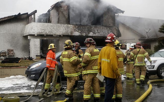 Firefighters suppress a fire at the scene of a deadly plane crash in the residential neighborhood of Yorba Linda, California, Sunday, February 3, 2019. (AP Photo/Alex Gallardo) Firefighters suppress a fire at the scene of a deadly plane crash in the residential neighborhood of Yorba Linda, California, Sunday, February 3, 2019. (AP Photo/Alex Gallardo)