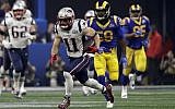 New England Patriots' Julian Edelman (11) runs the ball ahead of Los Angeles Rams' Cory Littleton (58) during the second half of the NFL Super Bowl 53 football game Sunday, Feb. 3, 2019, in Atlanta. (AP Photo/Jeff Roberson)