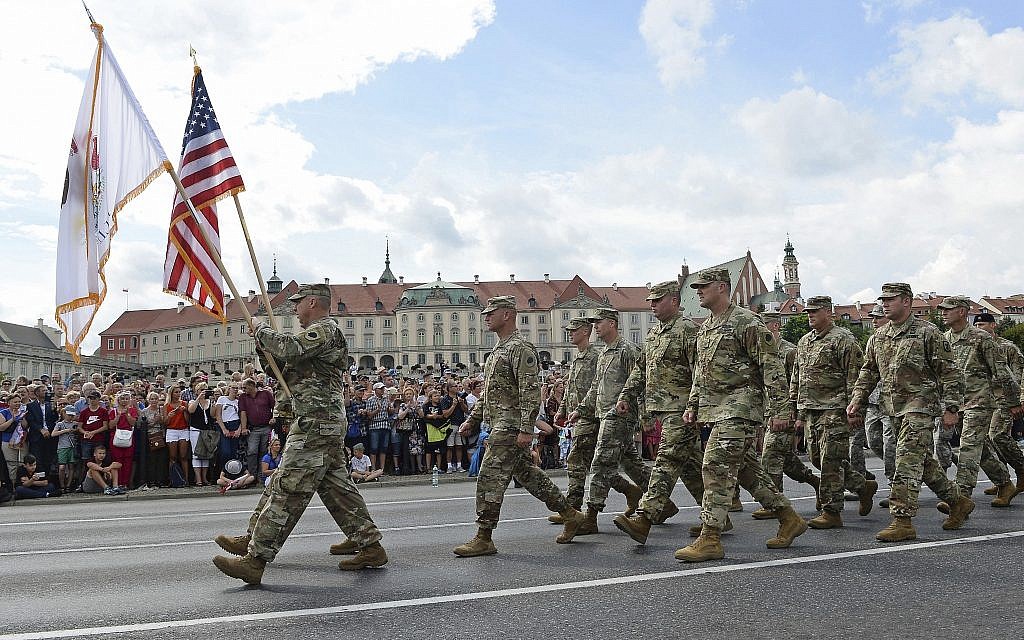 In this August 15, 2018, photo, a group of US Army soldiers take part in an annual military parade celebrating Polish Army Day in Warsaw, Poland. (AP Photo/Alik Keplicz, File)