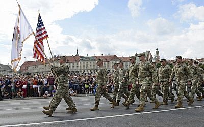 In this August 15, 2018, photo, a group of US Army soldiers take part in an annual military parade celebrating Polish Army Day in Warsaw, Poland. (AP Photo/Alik Keplicz, File)