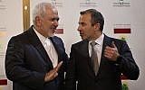 Lebanese Foreign Minister Gebran Bassil, right, speaks with his Iranian counterpart Mohammad Javad Zarif, in Beirut, Lebanon, on February 11, 2019. (AP Photo/Hussein Malla)