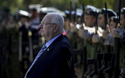 President Reuven Rivlin reviews a military guard of honor during a welcoming ceremony before a meeting with Cyprus's President Nicos Anastasiades at the presidential palace in Nicosia, Cyprus, on February 12, 2019. (AP Photo/Petros Karadjias)