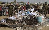 Hamas security forces prepare to burn some 1,383 bars of hashish and 1,242,000 pills of Tramadol, in Gaza City on Oct. 22, 2018. (AP Photo/Adel Hana)