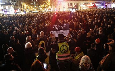 Illustrative: A man wearing a yellow vest holds a placard reading 'I [too] am a 
Jew,' during a gathering at the Republique square to protest against anti-Semitism, in Paris, France, February 19, 2019.  (AP Photo/Thibault Camus