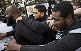 'Empire' actor Jussie Smollett, center, leaves Cook County jail following his release, Thursday, February 21, 2019, in Chicago. (Ashlee Rezin/Chicago Sun-Times via AP)