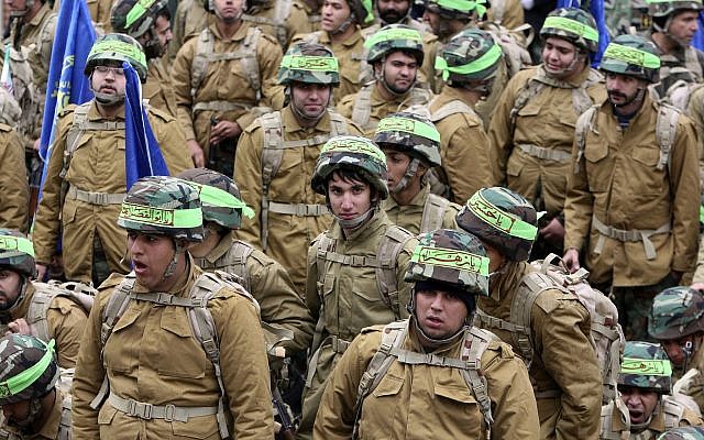 Illustrative: Members of the Iranian paramilitary Basij force, affiliated with the Revolutionary Guard, attend a rally in front of the former US Embassy in Tehran, Iran, on November 25, 2011. (AP Photo/Vahid Salemi) Illustrative: Members of the Iranian paramilitary Basij force, affiliated with the Revolutionary Guard, attend a rally in front of the former US Embassy in Tehran, Iran, on November 25, 2011. (AP Photo/Vahid Salemi)
