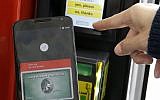 In this May 28, 2015, file photo, a Google employee gives a demonstration of Android Pay on a phone at Google I/O 2015 in San Francisco (AP Photo/Jeff Chiu, File)