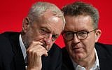 Britain's opposition Labour Party leader Jeremy Corbyn, left, talks with deputy leader Tom Watson, during the start of the party's annual conference in Liverpool, England, September 23, 2018. (Stefan Rousseau/PA via AP)