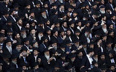 Illustrative: Crowds of rabbis gather for a group photo at the Chabad-Lubavitch World Headquarters, November 4, 2018, in New York.(AP Photo/Mark Lennihan)