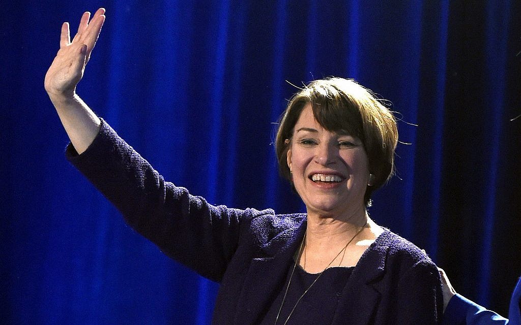 In this November 6, 2018, file photo, Sen. Amy Klobuchar waves to supporters after winning re-election during the Democratic election night party in St. Paul, Minnsota (AP Photo/Hannah Foslien In this November 6, 2018, file photo, Sen. Amy Klobuchar waves to supporters after winning re-election during the Democratic election night party in St. Paul, Minnsota (AP Photo/Hannah Foslien