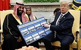 Illustrative: US President Donald Trump shows a chart highlighting arms sales to Saudi Arabia during a meeting with Saudi Crown Prince Mohammed bin Salman in the Oval Office of the White House in Washington on March 20, 2018. (AP Photo/Evan Vucci)