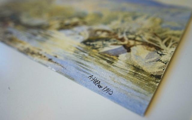 A watercolor landscape, allegedly painted by a young Adolf Hitler, is displayed at an auction house in Berlin, Germany, January 24, 2019. (Gregor Fischer/dpa via AP)