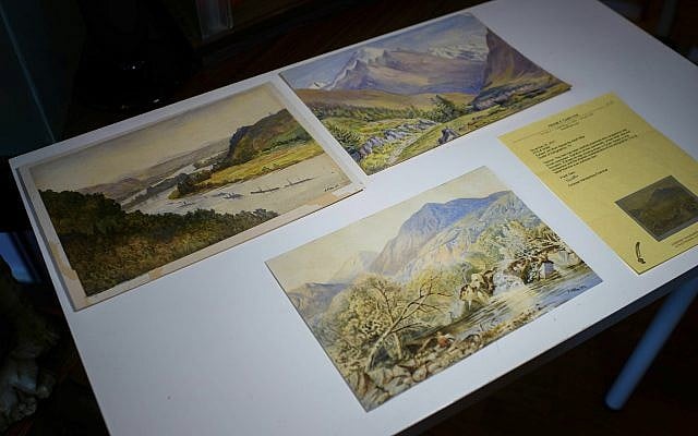 Three watercolor landscapes, allegedly painted by a young Adolf Hitler, are displayed at an auction house in Berlin, Germany, January 24, 2019. (Gregor Fischer/dpa via AP)