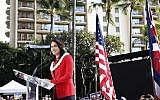 US Rep. Tulsi Gabbard, D-Hawaii, speaks during a campaign rally announcing her candidacy for president in Waikiki, Saturday, Feb. 2, 2019, in Honolulu. (AP Photo/Marco Garcia)