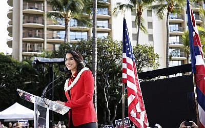 US Rep. Tulsi Gabbard, D-Hawaii, speaks during a campaign rally announcing her candidacy for president in Waikiki, Saturday, Feb. 2, 2019, in Honolulu. (AP Photo/Marco Garcia)