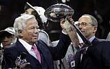New England Patriots owner Robert Kraft, left, lifts the trophy beside son and team president Jonathan Kraft, right, after winning the NFL Super Bowl 53 football game against the Los Angeles Rams, February 3, 2019, in Atlanta. (AP Photo/Patrick Semansky)
