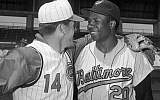 In this April 1, 1966, file photo, Cincinnati Reds' Pete Rose, left, greets Baltimore Orioles' Frank Robinson before a spring training baseball game, in Tampa, Fla. (AP/Paul Shane)