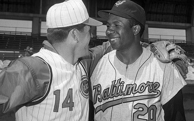 In this April 1, 1966, file photo, Cincinnati Reds' Pete Rose, left, greets Baltimore Orioles' Frank Robinson before a spring training baseball game, in Tampa, Fla. (AP/Paul Shane) In this April 1, 1966, file photo, Cincinnati Reds' Pete Rose, left, greets Baltimore Orioles' Frank Robinson before a spring training baseball game, in Tampa, Fla. (AP/Paul Shane)