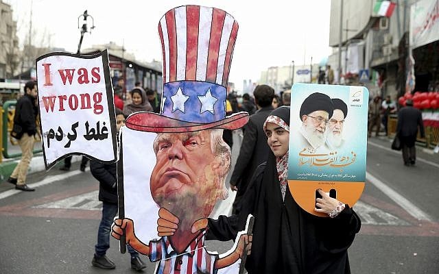 An Iranian woman holds an effigy of US president Donald Trump, during a rally marking the 40th anniversary of the 1979 Islamic Revolution, in Tehran, Iran, February 11, 2019. (AP/Ebrahim Noroozi/File)