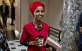 In this Jan. 16, 2019 file photo, Rep. Ilhan Omar, D-Minn., center, walks through the halls of the Capitol Building in Washington. (AP/Andrew Harnik)