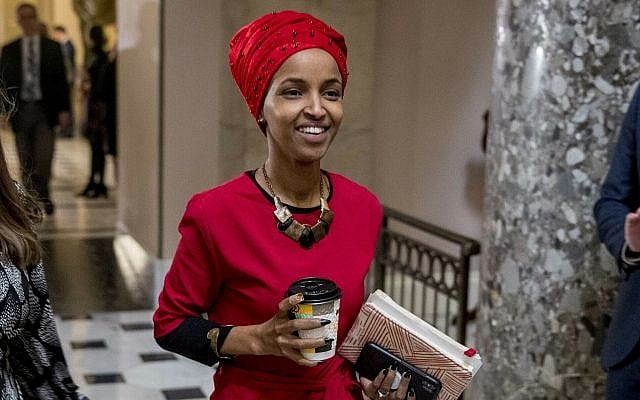 In this Jan. 16, 2019 file photo, Rep. Ilhan Omar, D-Minn., center, walks through the halls of the Capitol Building in Washington. (AP/Andrew Harnik) In this Jan. 16, 2019 file photo, Rep. Ilhan Omar, D-Minn., center, walks through the halls of the Capitol Building in Washington. (AP/Andrew Harnik)