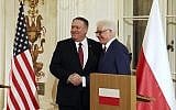 Polish Foreign Affairs Minister Jacek Czaputowicz,right, and US Secretary of State Mike Pompeo shake hands at a news conference at Lazienki Palace, Warsaw, Poland, February 12, 2019. (AP Photo/Czarek Sokolowski)