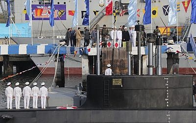 Iranian President Hassan Rouhani, center with white turban, and other dignitaries attend the inauguration of the new Iranian made 'Fateh' submarine in Bandar Abbas on February 17, 2019. (Iranian Presidency Office via AP)