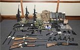 This image provided by the U.S. District Court in Maryland shows a photo of firearms and ammunition that was in the motion for detention pending trial in the case against Christopher Paul Hasson. Prosecutors say that Hasson, a Coast Guard lieutenant is a "domestic terrorist"  (US District Court via AP)