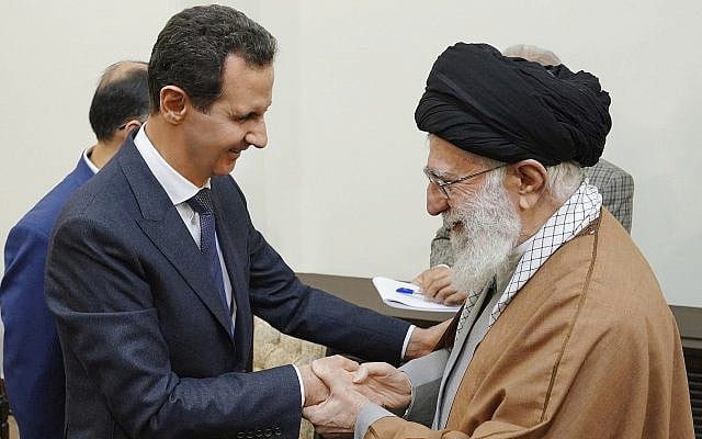 Syrian President Bashar Assad, left, shakes hands with Iranian Supreme Leader Ayatollah Ali Khamenei, before their meeting in Tehran, Syria, February 25, 2019. (Photo released by the Syrian official news agency, SANA, via AP) Syrian President Bashar Assad, left, shakes hands with Iranian Supreme Leader Ayatollah Ali Khamenei, before their meeting in Tehran, Syria, February 25, 2019. (Photo released by the Syrian official news agency, SANA, via AP)