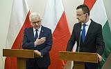 Polish Minister of Foreign Affairs Jacek Czaputowicz, left, and Hungarian Minister of Foreign Affairs and Trade Peter Szijjarto hold a joint press conference at the Minister of Foreign Affairs and Trade in Budapest, Hungary, February 27, 2019. (Zoltan Balogh/MTI via AP)