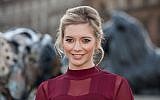 TV presenter Rachel Riley poses for photographers after unveiling a new clockwork Lion statue in Trafalgar Square, London, Jan. 28, 2016. (Photo by Grant Pollard/Invision/AP)