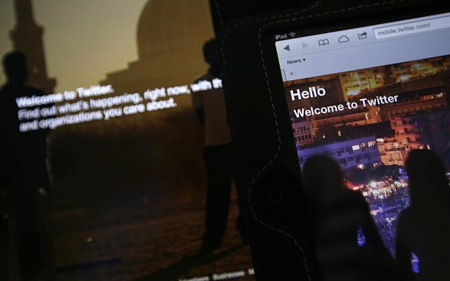 In this July 31, 2013 photo, the home page for Twitter is displayed on an iPad and a laptop computer. (AP Photo/Alastair Grant) In this July 31, 2013 photo, the home page for Twitter is displayed on an iPad and a laptop computer. (AP Photo/Alastair Grant)