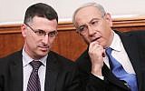 Prime Minister Benjamin Netanyahu, right, and then-interior minister Gideon Sa'ar, left, at the Prime Minister's Office in Jerusalem on December 25, 2012. (Miriam Alster/ Flash90/ File)