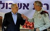 Prime Minister Benjamin Netanyahu, left, and then-IDF chief of staff Benny Gantz at the Eshkol Regional Council in southern Israel, on September 22, 2014. (Edi Israel/Pool/Flash90)