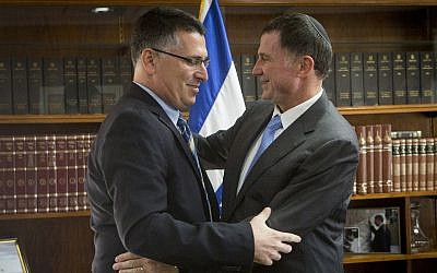 Then-interior minister Gideon Sa'ar (L) seen after handing his official letter of resignation from politics to Knesset speaker Yuli Edelstein, November 3, 2014. (Miriam Alster/Flash90)