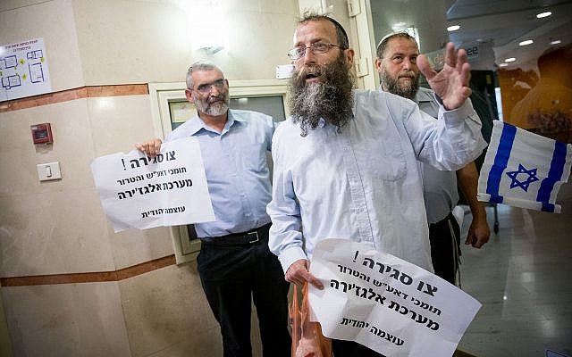 Otzma Yehudit members Michael Ben Ari (L), Baruch Marzel (C) and Benzi Gopstein protest at the entrance to the Al Jazeera offices in Jerusalem on June 13, 2017. (Yonatan Sindel/Flash90) Otzma Yehudit members Michael Ben Ari (L), Baruch Marzel (C) and Benzi Gopstein protest at the entrance to the Al Jazeera offices in Jerusalem on June 13, 2017. (Yonatan Sindel/Flash90)