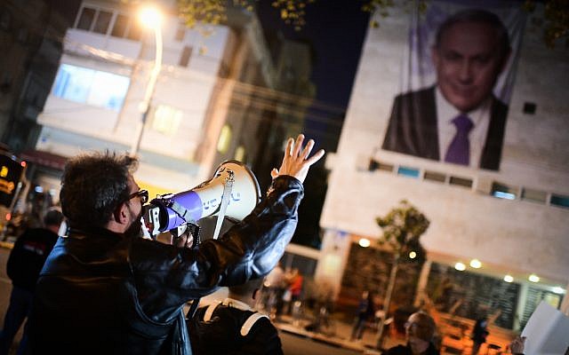 Activists protest against Prime Minister Benjamin Netanyahu and the new party TV station outside the Likud headquarters in Tel Aviv on February 3, 2019. (Tomer Neuberg/ Flash90) Activists protest against Prime Minister Benjamin Netanyahu and the new party TV station outside the Likud headquarters in Tel Aviv on February 3, 2019. (Tomer Neuberg/ Flash90)