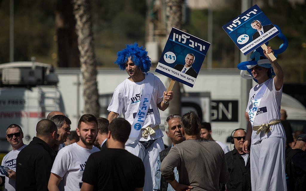 Likud supporters campaign for party members and candidates at the Tel Aviv Likud polling station on February 5, 2019. (Hadas Parush/Flash90)
