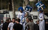 Likud supporters campaign for party members and candidates at the Tel Aviv Likud polling station on February 5, 2019. (Hadas Parush/Flash90)