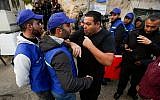 Israeli local Ofer Ohana argues with members of a new Palestinian observer group in the West Bank city of Hebron on February 10, 2019.(Wisam Hashlamoun/Flash90)