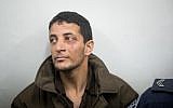 Arafat Irfaiya, charged with the murder of Ori Ansbacher, at the Jerusalem Magistrate's Court on February 11, 2019. (Yonatan Sindel/Flash90)
