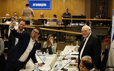 Tzomet party head MK Oren Hazan takes a selfie as he present his party list at the Central Elections Committee, on February 21, 2019 (Yonatan Sindel/Flash90)
