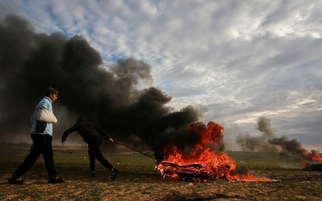 Palestinian protesters during clashes with Israeli forces along the border with Israel, east of Rafah in the southern Gaza Strip, on February 22, 2019. (Abed Rahim Khatib/ Flash90) Palestinian protesters during clashes with Israeli forces along the border with Israel, east of Rafah in the southern Gaza Strip, on February 22, 2019. (Abed Rahim Khatib/ Flash90)