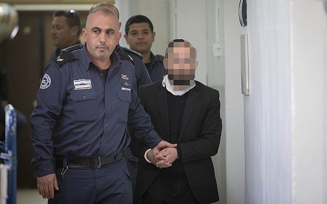A suspect in the murder of Yehuda and Tamar Kaduri is brought before the Jerusalem Magistrate's Court, on February 26, 2019. (Noam Revkin Fenton/Flash90) A suspect in the murder of Yehuda and Tamar Kaduri is brought before the Jerusalem Magistrate's Court, on February 26, 2019. (Noam Revkin Fenton/Flash90)